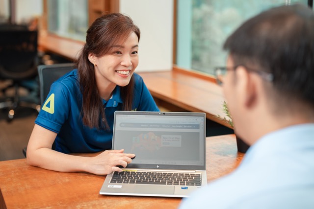 An SG Enable consultant walking an employer through the framework
