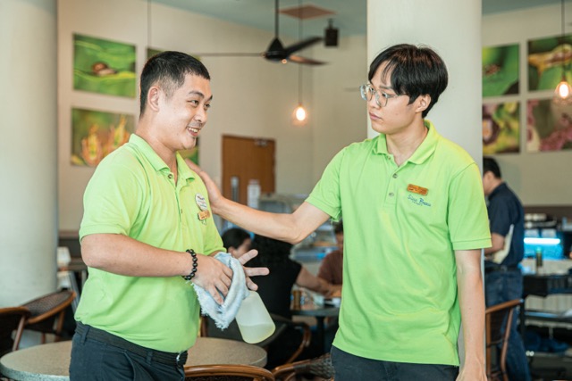 Two colleagues working together at an inclusive workplace